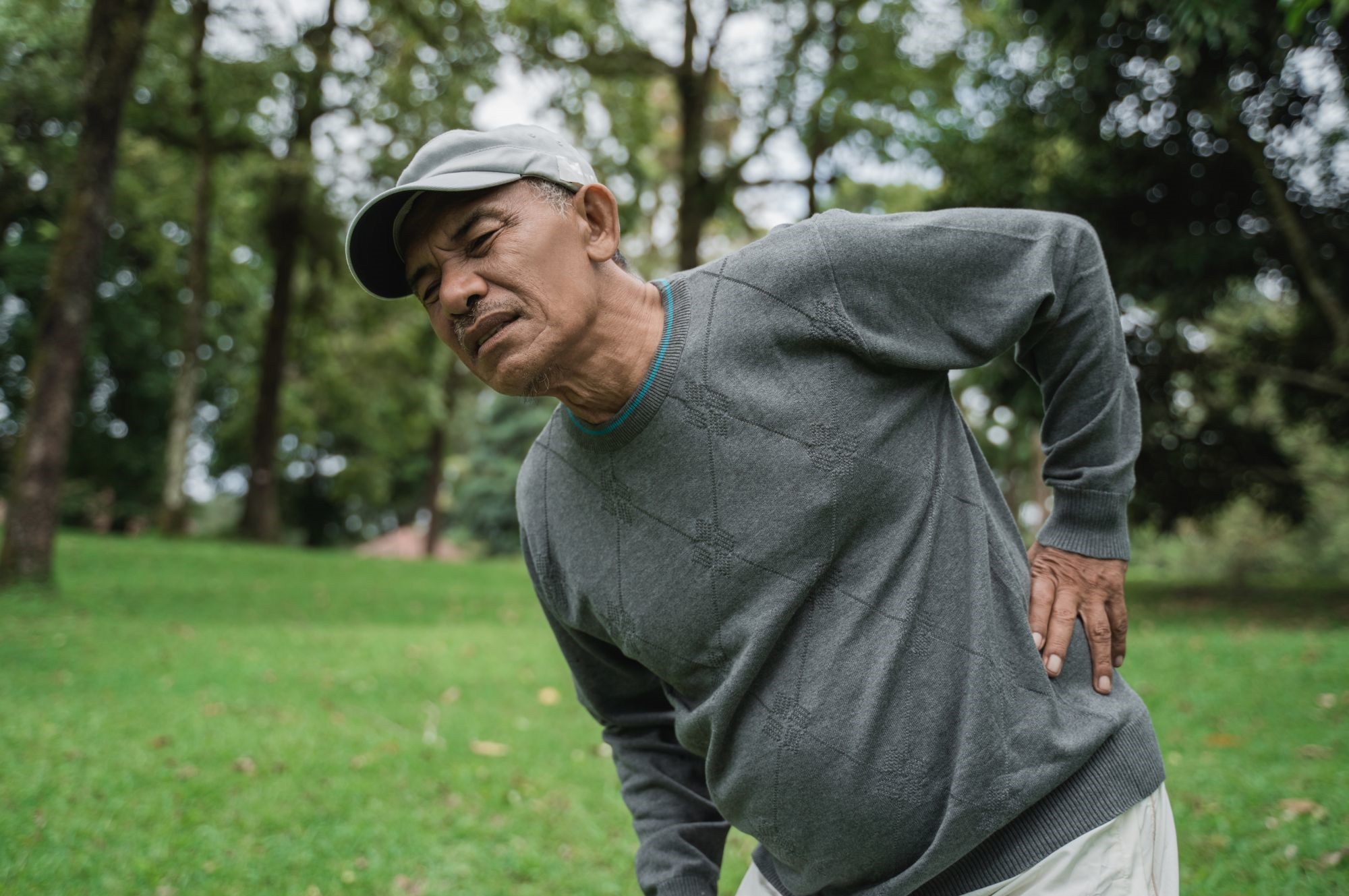 A man suffering from back pain.